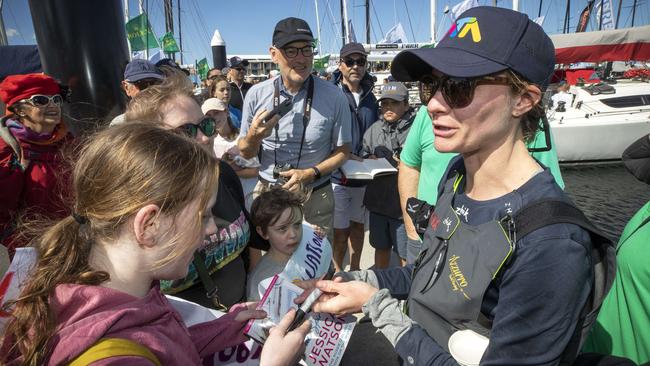 Jessica Watson signs autographs after arriving at Hobart on-board the Azzurro. Picture: Chris Kidd