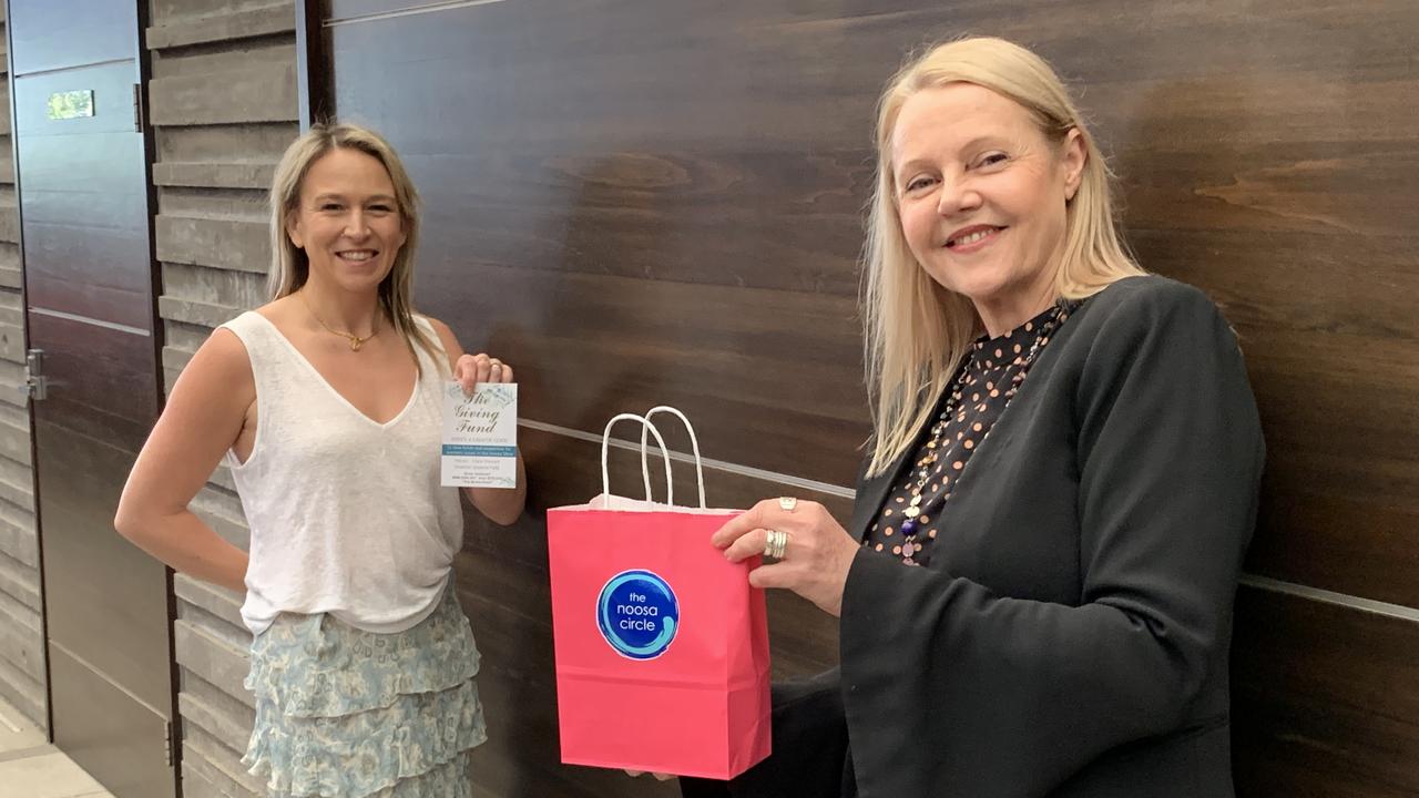 Kelly Hannah Carthy and Noosa MP Sandy Bolton show off the attendees' gift bags.