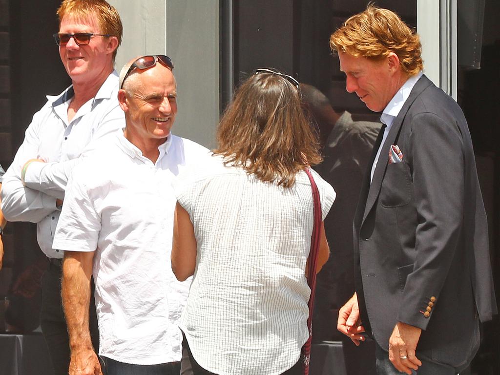 Bluey McGrath, Andrew Bews and Cameron Ling outside the memorial for Michael Turner. Picture: Alison Wynd