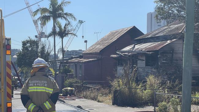 Fire crews at a home on Reid St, Woolloongabba, after it caught alight this morning, August 23. Picture: Brendan O'Malley