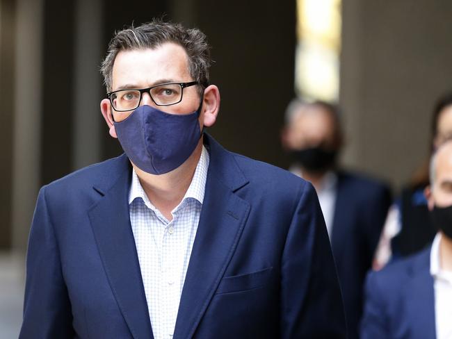 MELBOURNE, AUSTRALIA - AUGUST 02: Victorian Premier Daniel Andrews walks into a press conference on August 02, 2020 in Melbourne, Australia. Victorian Premier Daniel Andrews has announced a 'State of Disaster' and increased restrictions for Victoria. The Premier announced that 671 new cases of COVID were detected, 73 connected to outbreaks, 598 under investigation and seven people died overnight. Stage 3 restrictions will be reintroduced to regional Victoria.  An 8pm to 5am curfew will be introduced starting today. (Photo by Darrian Traynor/Getty Images)