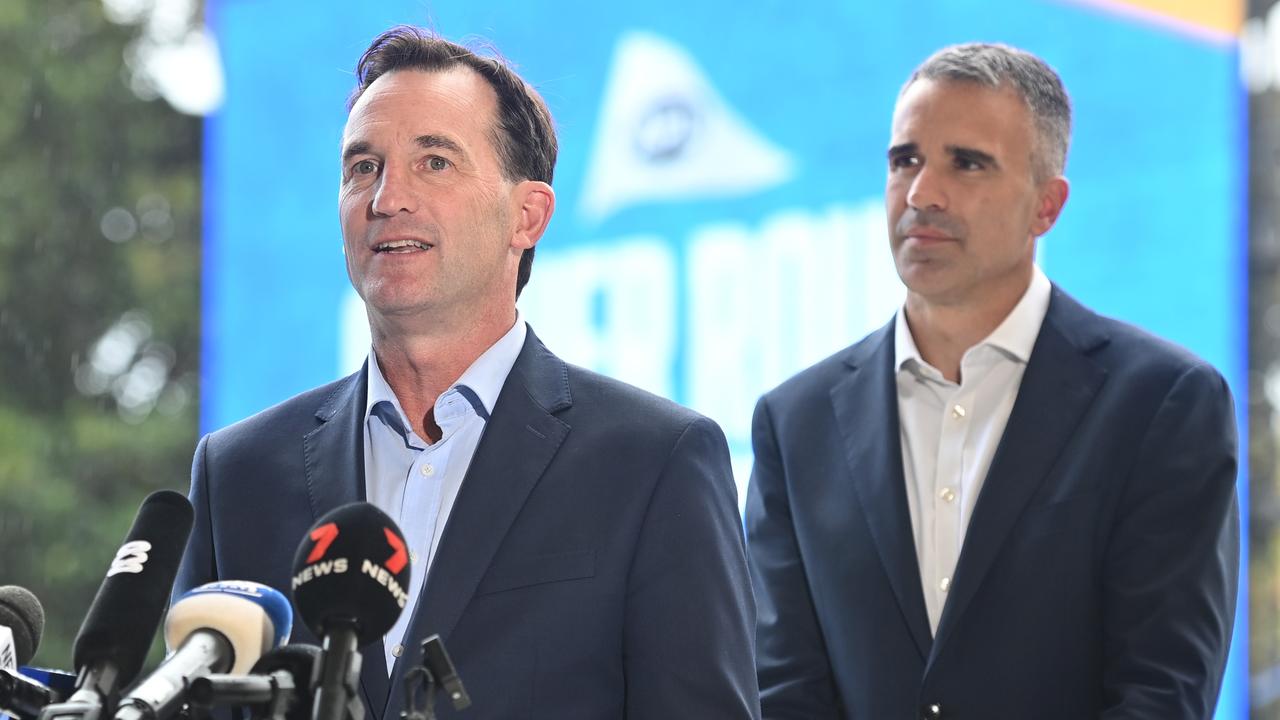 AFL chief executive officer Andrew Dillon (left), watched by Premier Peter Malinauskas. Picture: Keryn Stevens