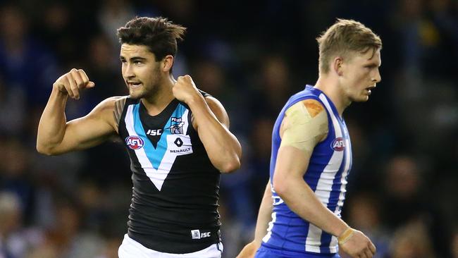 Chad Wingard celebrates a goal much to Jack Ziebell’s disappointment. Picture: Getty Images