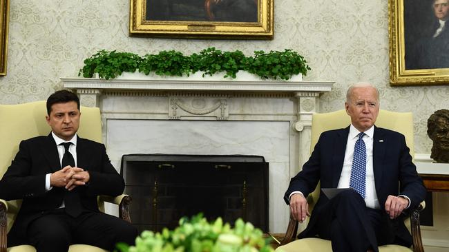 Joe Biden, right, meets with Ukraine's President Volodymyr Zelensky in the Oval Office of the White House in 2021. Picture: AFP