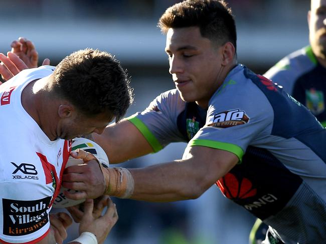 Tariq Sims of the Dragons has the ball stripped by Joseph Tapine of the Raiders (right) during the Round 11 NRL match between the St George-Illawarra Dragons and the Canberra Raiders at Glen Willow Oval in Mudgee, NSW, Sunday, May 20, 2018. (AAP Image/Dan Himbrechts) NO ARCHIVING, EDITORIAL USE ONLY