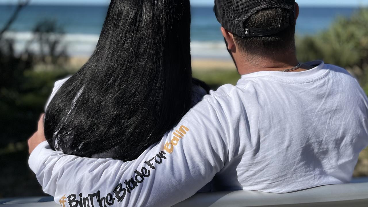 Kerri-Lyn and Michael Stewart on a chair at Buddina that is dedicated to their son Balin.