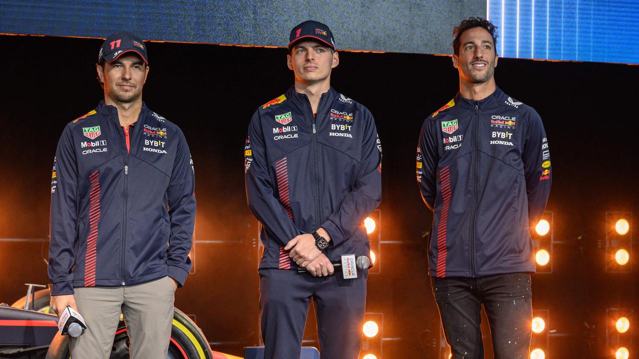 Ricciardo is tipped to replace Sergio Perez (left) in 2025. (Photo by ED JONES / AFP)