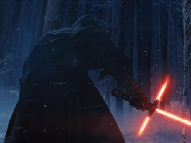 This photo provided by Disney shows, Adam Driver as Kylo Ren with his Lightsaber in a scene from the new film, "Star Wars: The Force Awakens." The movie releases in the U.S. on Dec. 18, 2015. (Film Frame/Disney/Copyright Lucasfilm 2015 via AP)