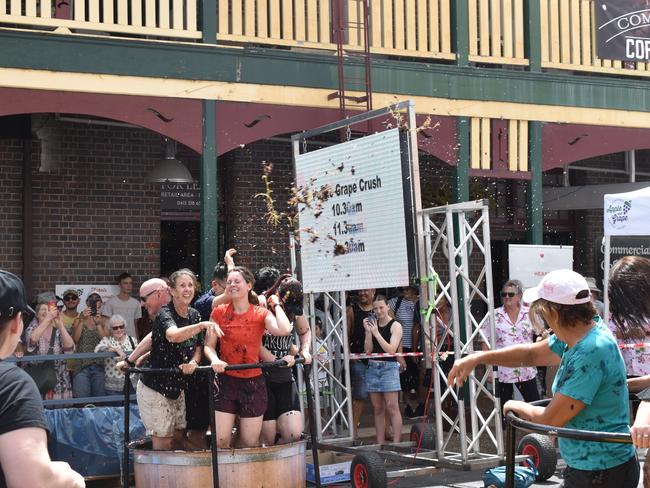 It doesn't take long for the grapes to begin flying at the Apple and Grape Festival grape crush, March 1, 2024