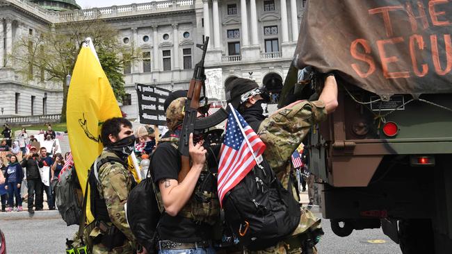 People take part in a "reopen Pennsylvania” demonstration on April 20, 2020 in Harrisburg, Pennsylvania. Picture: AFP.