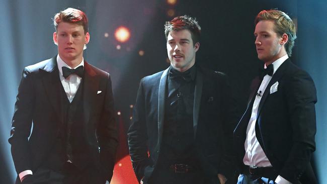 Sam Walsh, Zach Merrett and Darcy Parish chat during the 2021 Brownlow Medal count.