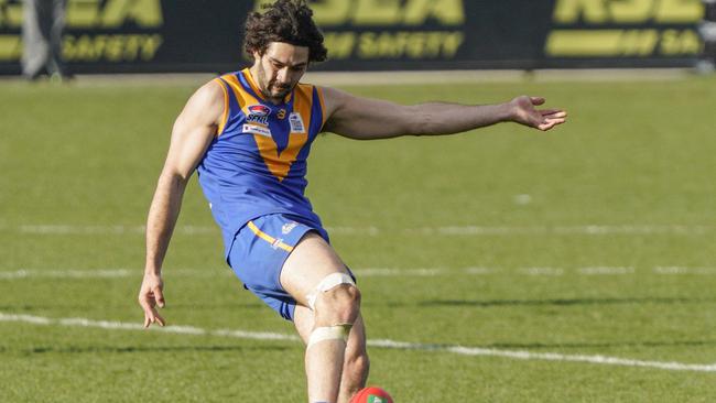 Kirk Dickson takes a kick for Cranbourne. Picture: Valeriu Campan