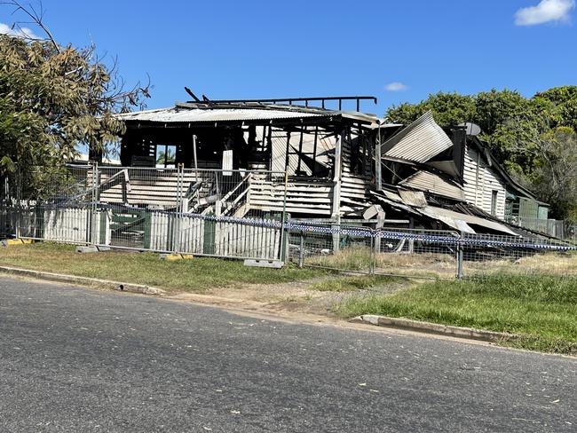 The scene of a house fire in Maryborough has been fenced off and police tape remains around the property.