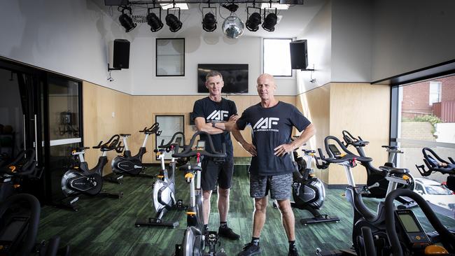 Owners of All Aerobics Terry Moore and Guy Franklin in their empty Hobart gym. Picture: LUKE BOWDEN