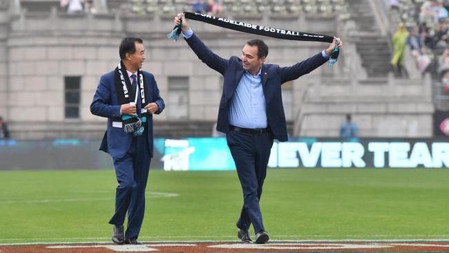 South Australian Premier Steven Marshall with Shanghai CRED billionaire owner Guojie Gui at Jiangwan Stadium in Shanghai, China last year. Picture: AAP Image/David Mariuz