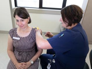 SYDNEY, AUSTRALIA - MARCH 10: (EDITORS NOTE: Parts of this image have been obscured for privacy reasons) New South Wales PremierÃÂ GladysÃÂ Berejiklian receives the AstraZeneca vaccine at at St George Hospital in Kogarah on March 10, 2021 in Sydney, Australia. NSW will begin administering the AstraZenica COVID-19 vaccine across the state from today, with vaccination hubs at St George and Hornsby Hospitals with frontline workers, healthcare staff and vulnerable persons to receive injections as a priority. The AstraZenica coronavirus vaccine is administered in two doses, 12 weeks apart. (Photo by Brook Mitchell/Pool/Getty Images)