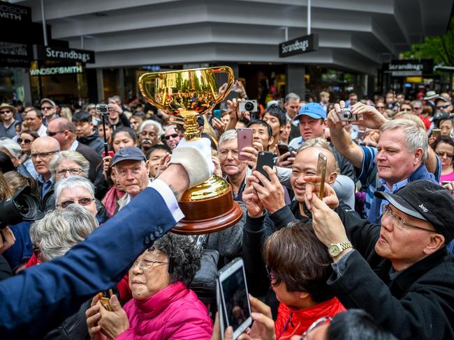 Fans get a glimpse of the Melbourne Cup during last year’s parade. Extra bollards will be in place for this year’s big event. Picture: Jake Nowakowski