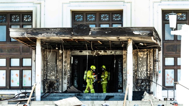 A 30-year-old man has been arrested following a fire damaged the front entrance of the Old Parliament House. Picture: Xinhua via Getty Images