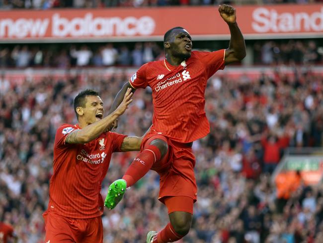 Liverpool's Christian Benteke, right, celebrates with teammate Dejan Lovren after scoring for the Reds