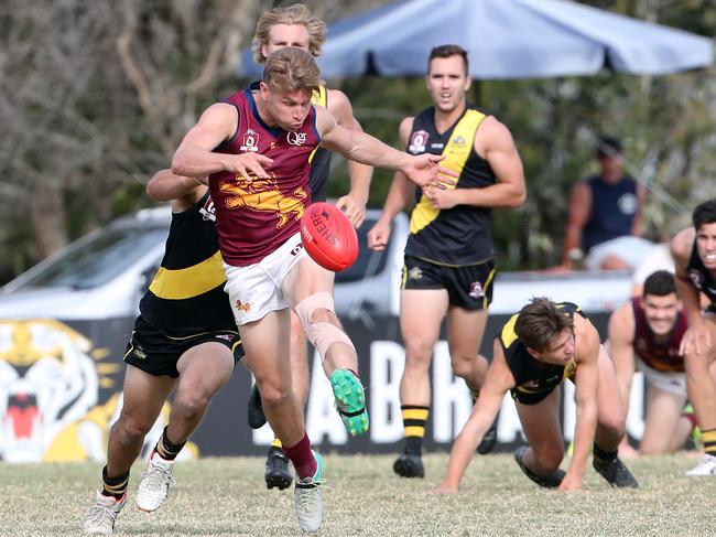 Palm Beach-Currumbin player Jason Burge kicking. Picture: Richard Gosling