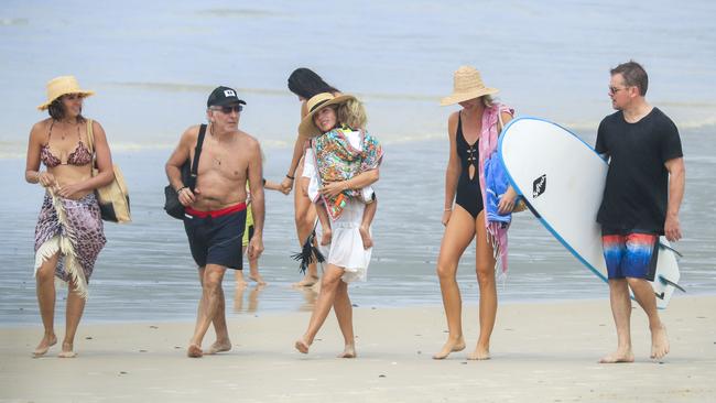 Damon with a surf board in hand with friends, including Chris Hemsworth’s wife Elsa Pataky. Picture: MEDIA MODE/BACKGRID