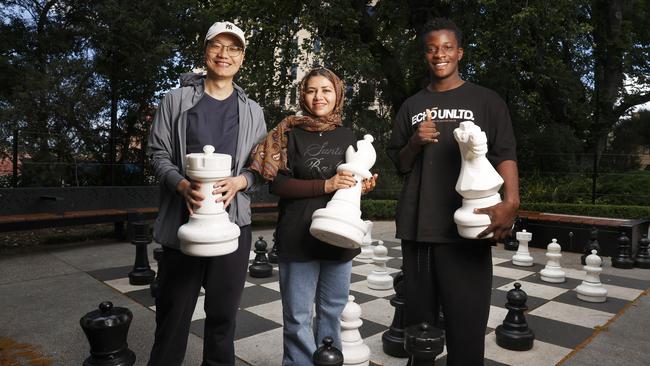 Julian Li originally from China, Fatemeh Papolzai originally from Afghanistan, Jeremie Kasigwas originally from the Democratic Republic of Congo who are all taking part in the migrant english program at TasTAFE and found a love for chess too.  Picture: Nikki Davis-Jones