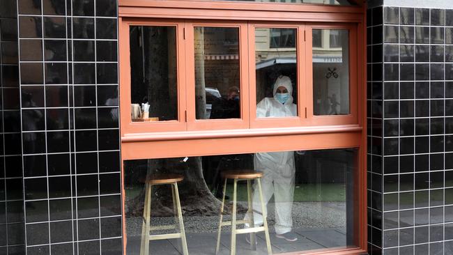 Cleaners inside the The Crafty Squire on Sunday. Picture: Rebecca Michael