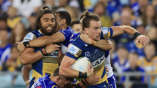 SYDNEY, AUSTRALIA - MAY 01: Clint Gutherson of the Eels is tackled during the round eight NRL match between the Canterbury Bulldogs and the Parramatta Eels at Stadium Australia, on May 01, 2021, in Sydney, Australia. (Photo by Mark Evans/Getty Images)