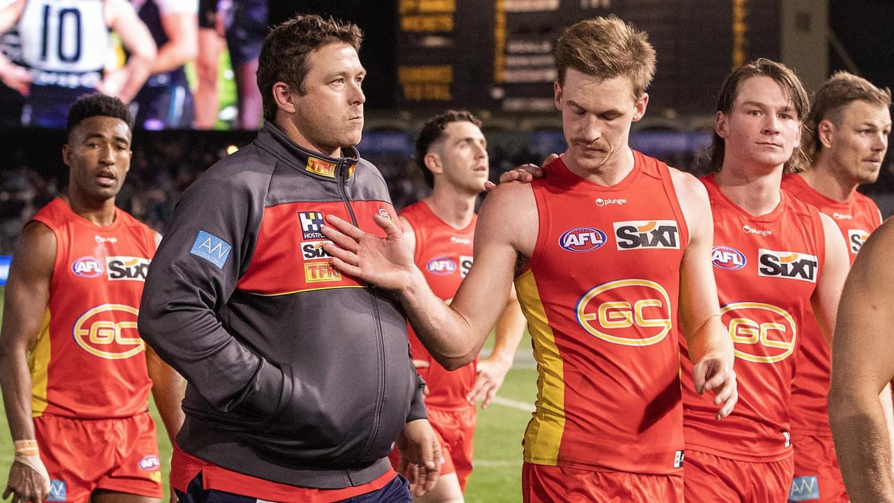 Stuart Dew with Gold Coast young star Noah Anderson following the Suns loss to Port Adelaide. Picture: Sarah Reed/AFL Photos via Getty Images