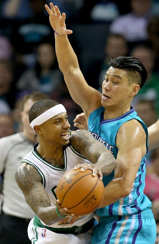 Jeremy Lin #7 of the Charlotte Hornets tries to stop Isaiah Thomas #4 of the Boston Celtics.