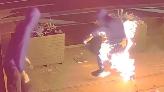 CCTV footage has captured the moment a bumbling arsonist set their pants on fire in an attempted attack on a fast food restaurant in Doncaster East on Christmas morning. Picture: VicPol