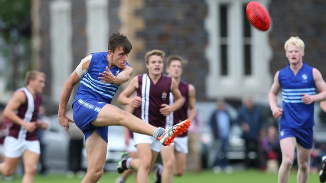 Liam Mackie — for Sacred Heart College — kicks the ball agains Prince Alfred College. Picture: Stephen Laffer.