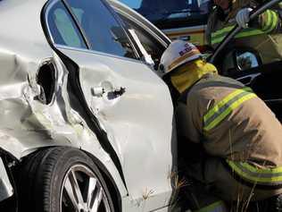 CRASH: Two vehicles collided at a major intersection on the New England Highway. Picture: Marian Faa