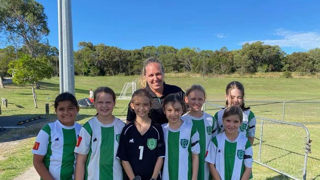 Amanda Milburn with Beerwah Glasshouse United junior players.