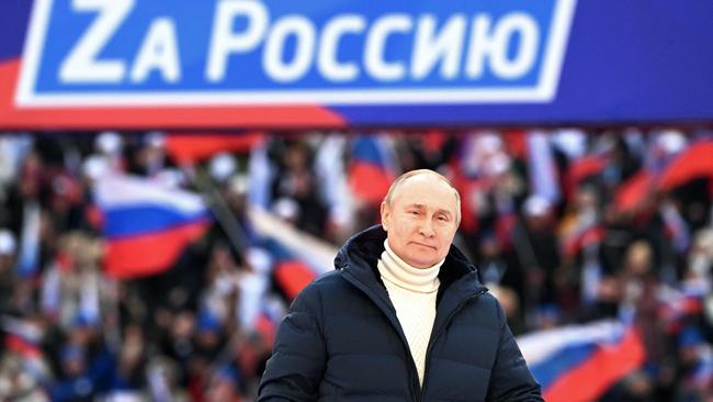 Russian President Vladimir Putin attends a concert marking the eighth anniversary of Russia's annexation of Crimea, at the Luzhniki stadium in Moscow, on March 18, 2022. Picture: AFP