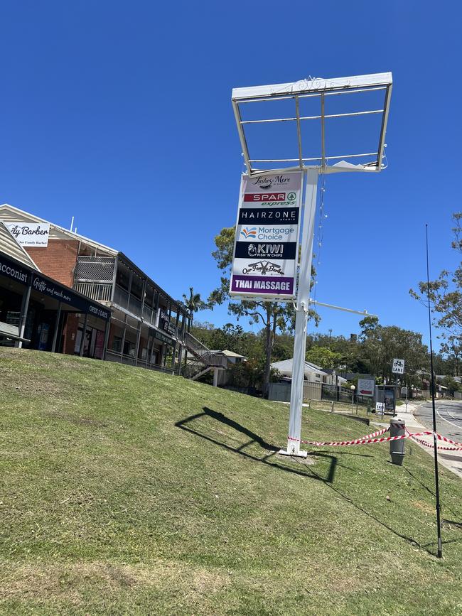 A badly damaged sign at Helensvale Village shopping centre. Picture: Keith Woods.