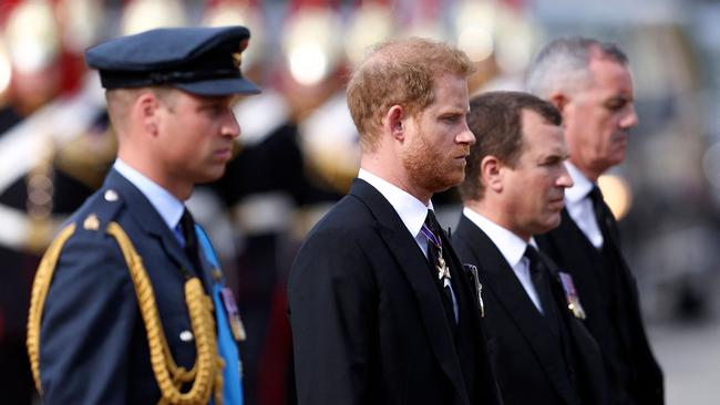 Britain's Prince William, Prince of Wales, Britain's Prince Harry, Duke of Sussex and Peter Phillips, walk behind the coffin of Queen Elizabeth II, during a procession from Buckingham Palace to the Palace of Westminster. Picture: AFP