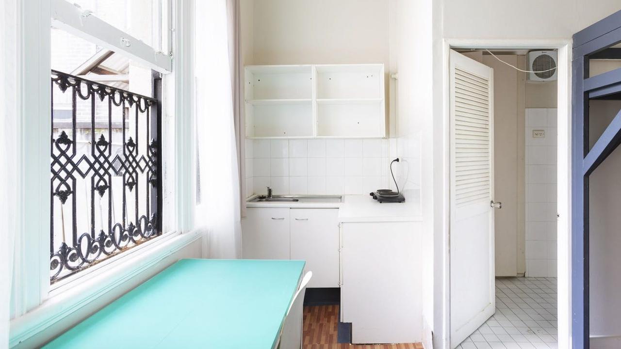 The kitchen and bathroom in the tiny Sydney unit. Picture: realestate.com.au