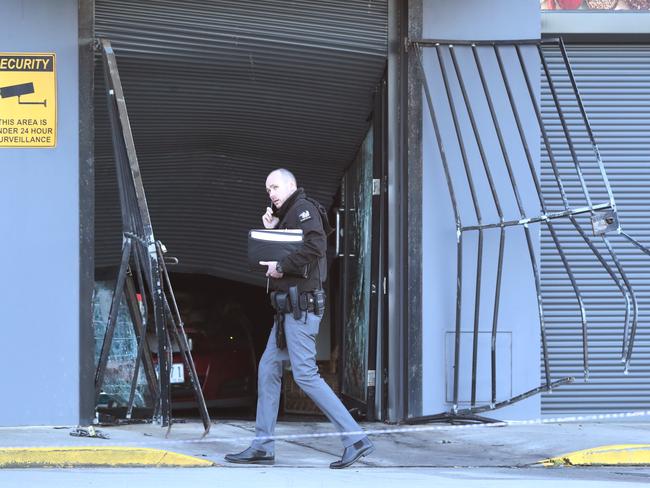 Police at the scene at the time of the arson attack. Picture: David Crosling