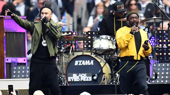 Was Will.i.am checking his messages or posting content at the 2018 grand final? Picture: Supplied.