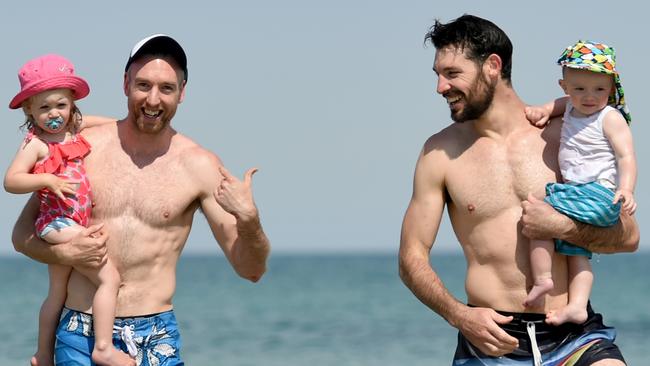 Adelaide 36ers recovery at Henley Beach. (L-R) Brendan Teys with daughter Frankie (2yrs) and Kevin White with son Quinn (1yrs). Picture: Tricia Watkinson