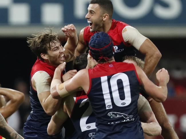 Demons players celebrate their win against Suns during the Round 8 AFL match between the Gold Coast Suns and the Melbourne Demons at Metricon Stadium on the Gold Coast, Saturday, May 11, 2019. (AAP Image/Regi Varghese) NO ARCHIVING, EDITORIAL USE ONLY