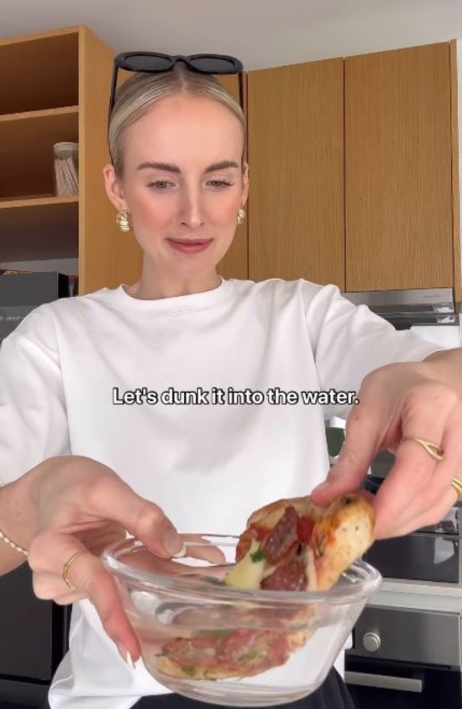 She said it felt “so wrong” to dunk her pizza in her water. Picture: Instagram/Bec Hardgrave