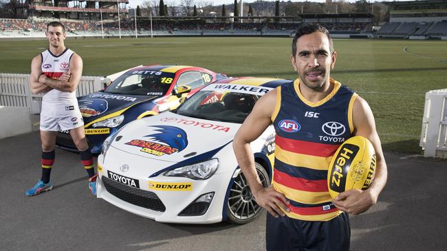 Taylor Walker and Eddie Betts inspect the cars that will carry their names at the maiden OTR SuperSprint at Tailem Bend next week. The cars will race in Crows colours during the Toyota 86 Racing Series at Tailem Bend. Picture: Toyota Australia