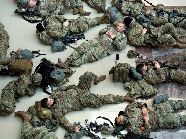 Members of the National Guard rest in the Capitol Visitors Center as Washington braces for more violence. Picture: AFP