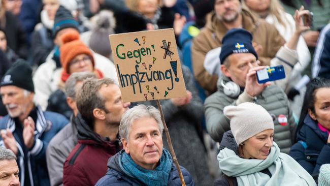 A demonstrator holds a placard reading 'against compulsory vaccination' during an anti-vaccination protest at the Ballhausplatz in Vienna, Austria. Picture: AFP