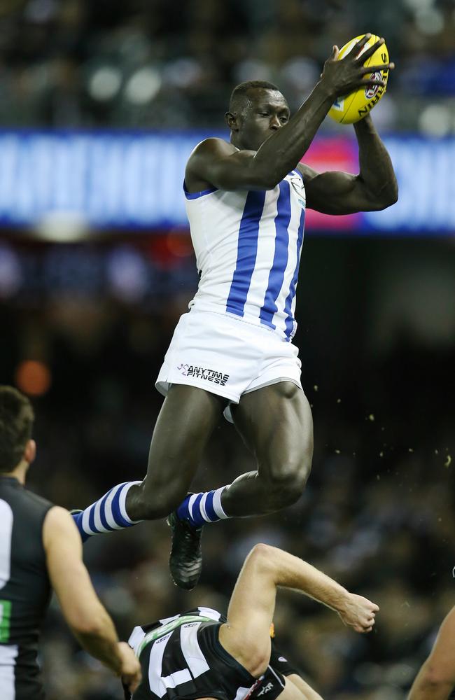 Majak Daw brings down a spectacular mark. Picture: Michael Klein