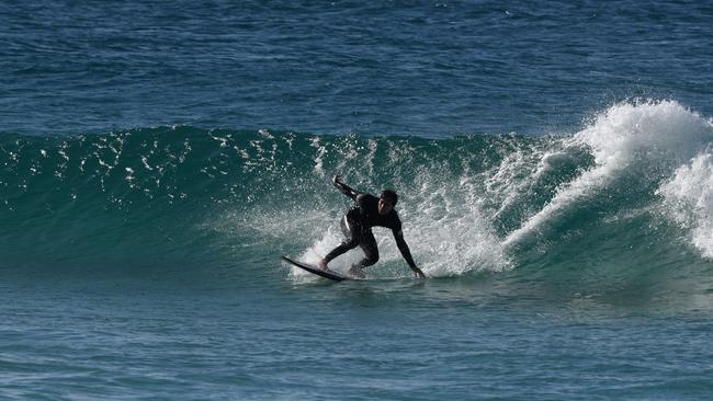 A surfer tackles a wave at Kirra Beach. Picture: NCA NewsWire/Steve Holland