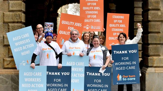 Aged care workers protest outside a aged care royal commission public forum in Adelaide. Picture: AAP Image/Sam Wundke.