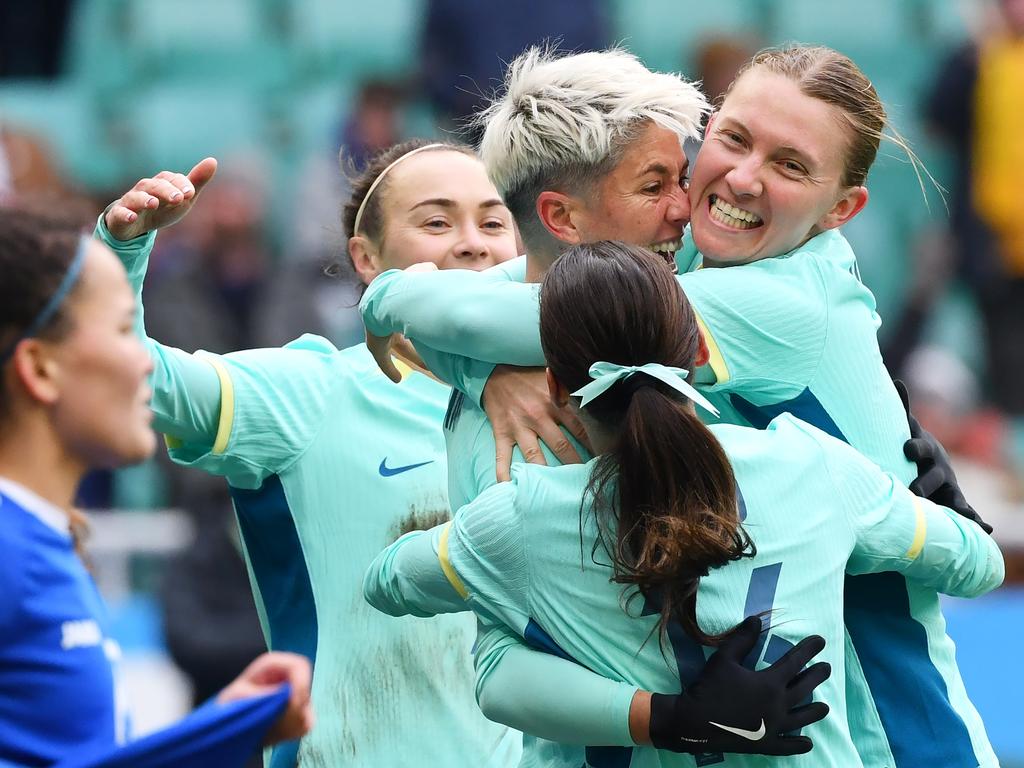 Michelle Heyman (centre) is congratulated by Matildas teammates after scoring in her return to the national team. Picture: Tolib Kosimov/Getty Images